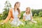 Mother and daughter pick flowers together