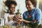 Mother and daughter planting at home, spending time together and having fun