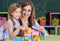 Mother and daughter playing with plastic blocks