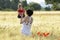 Mother and daughter in a poppy field