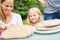 Mother and daughter prepare breakfast