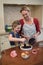 Mother and daughter preparing blue berry pie