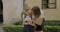 Mother and daughter relationship, schoolgirl using an outdoor phone with mother