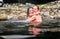 Mother and daughter relaxing in natural thermal water roman spa