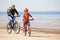 Mother and daughter riding on bicycles