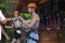 Mother and daughter riding down a zipline over the Tara Gorge, a river in Montenegro with the deepest canyon in Europe. Girls in