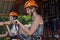 Mother and daughter riding down a zipline over the Tara Gorge, a river in Montenegro with the deepest canyon in Europe. Girls in