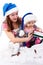 Mother and daughter in Santa\'s hat
