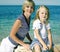 Mother with daughter at sea cost together, happy real family smiling looking to horizont, lifestyle people concept, on