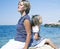 Mother with daughter at sea cost together, happy real family smiling looking to horizont, lifestyle people concept, on