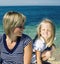 Mother with daughter at sea cost together, happy real family smiling looking to horizont, lifestyle people concept, on