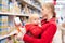 Mother with daughter shopping in supermarket