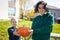 Mother and daughter show a pumpkin they grew at their farm