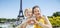 Mother and daughter showing heart shaped hands in Paris, France