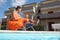 Mother and daughter sitting on beach chair