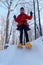 Mother and daughter snowshoeing together