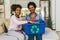 Mother and daughter sorting out clothes in boxes to donate