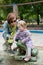 Mother and daughter sprayed water in the park