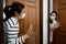 Mother and daughter standing at the door,greeting good night before going the bedroom,separate the room,self isolation quarantine,