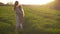 Mother and daughter standing in the  field