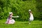 Mother and daughter in a summer park.