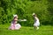 Mother and daughter in a summer park.