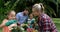 Mother and daughter talking while gardening together