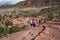Mother and daughter travelers hike to the Delicate Arch viewpoint trail women in 30s and 60s