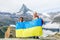 mother and daughter with Ukrainian flag in the mountains of switzerland
