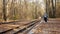 Mother and daughter waits for train