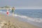 Mother and daughter, walk on beach