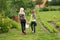 Mother and daughter walk home from the garden