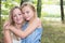 Mother and daughter walk in the Park love blond