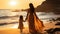 mother and daughter walking on the beach at sunset