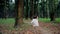 Mother and daughter walking in a deep forest