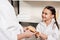 mother and daughter in white bathrobes holding hairbrush