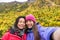 Mother daughter women taking selife on autumn hike
