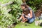 Mother and daughter working in the garden