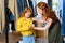 mother and daughter with yellow leather jacket shopping