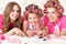 Mother and daughters in hair curlers