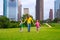 Mother and daughters walking holding hands on city skyline