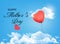 Mother day background. Holiday heart-shaped balloon in a blue sk