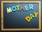 Mother day wooden word on black board