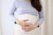Mother expecting woman holding hand on belly touching pregnancy baby child birth health care life body care healthy pain