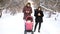 Mother and father addicted to mobile phones neglecting baby in stroller and while walking in winter park. Parents busy