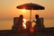 Mother with father and daughter sit on beach