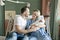 Mother and father with her newborn baby at the hospital a day after a natural birth labor