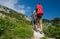 Mother and father hike with baby boy