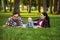 Mother, father and little baby leisures in park