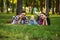 Mother, father and little baby leisures in park